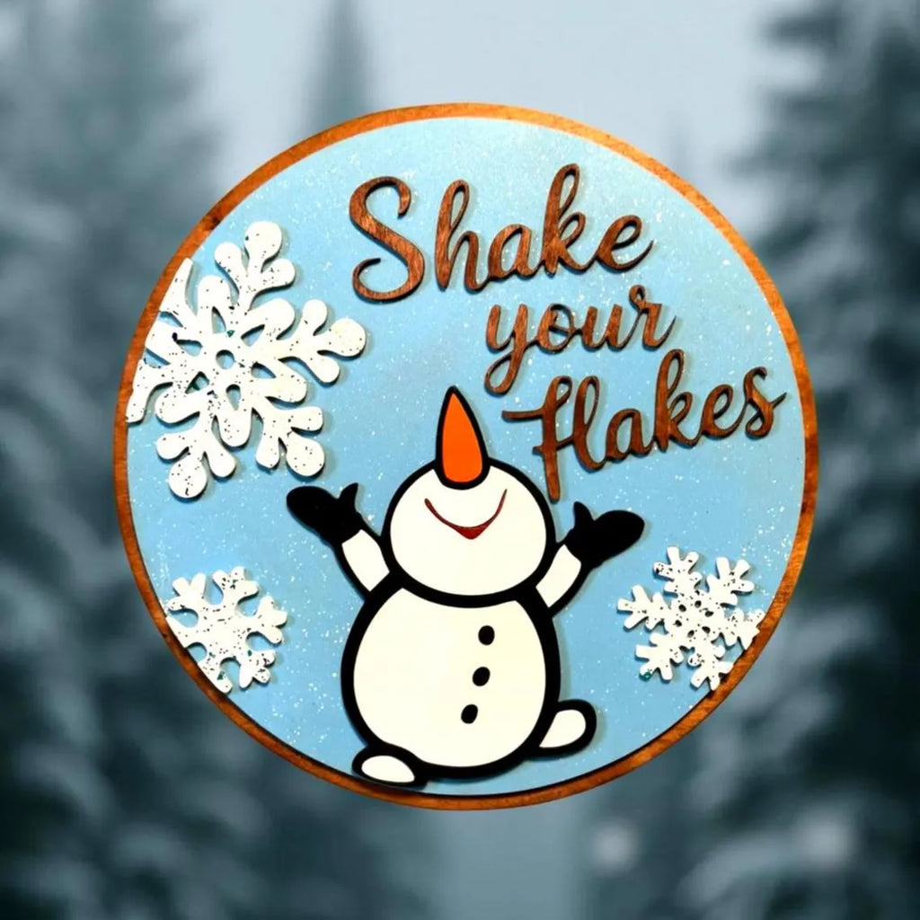 Shake Your Flakes Winter Sign – Round Wooden Snowman Decor – Layered Snowflake Door Hanger