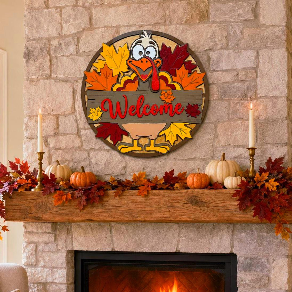 Thanksgiving turkey Welcome sign displayed above a stone fireplace mantel decorated with pumpkins, autumn leaves and taper candles.