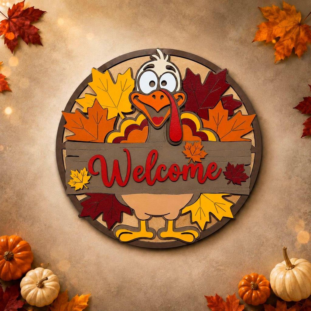 Layered wood turkey Welcome sign on a warm neutral background framed by colorful maple leaves and fall pumpkins.